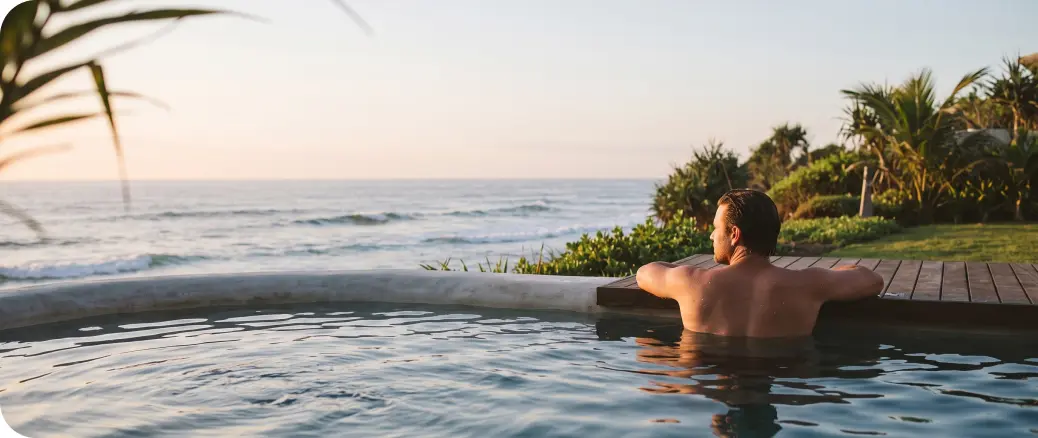 Guest in the pool at sunset