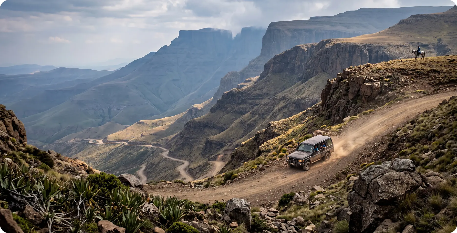 A 4x4 climbing the hairpin bends of the Sani Pass in the Drakensberg mountains